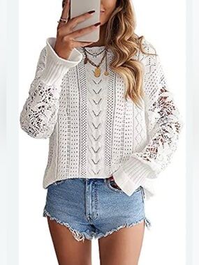 Theory Tissage crochet crewneck sweater in an ivory color.